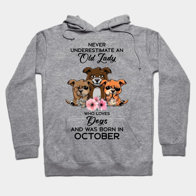 Never Underestimate An Old Woman Who Loves Dogs And Was Born In October Hoodie by Happy Solstice